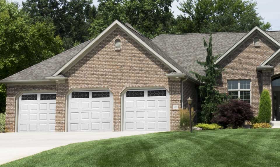 Regency model garage door on a brick home