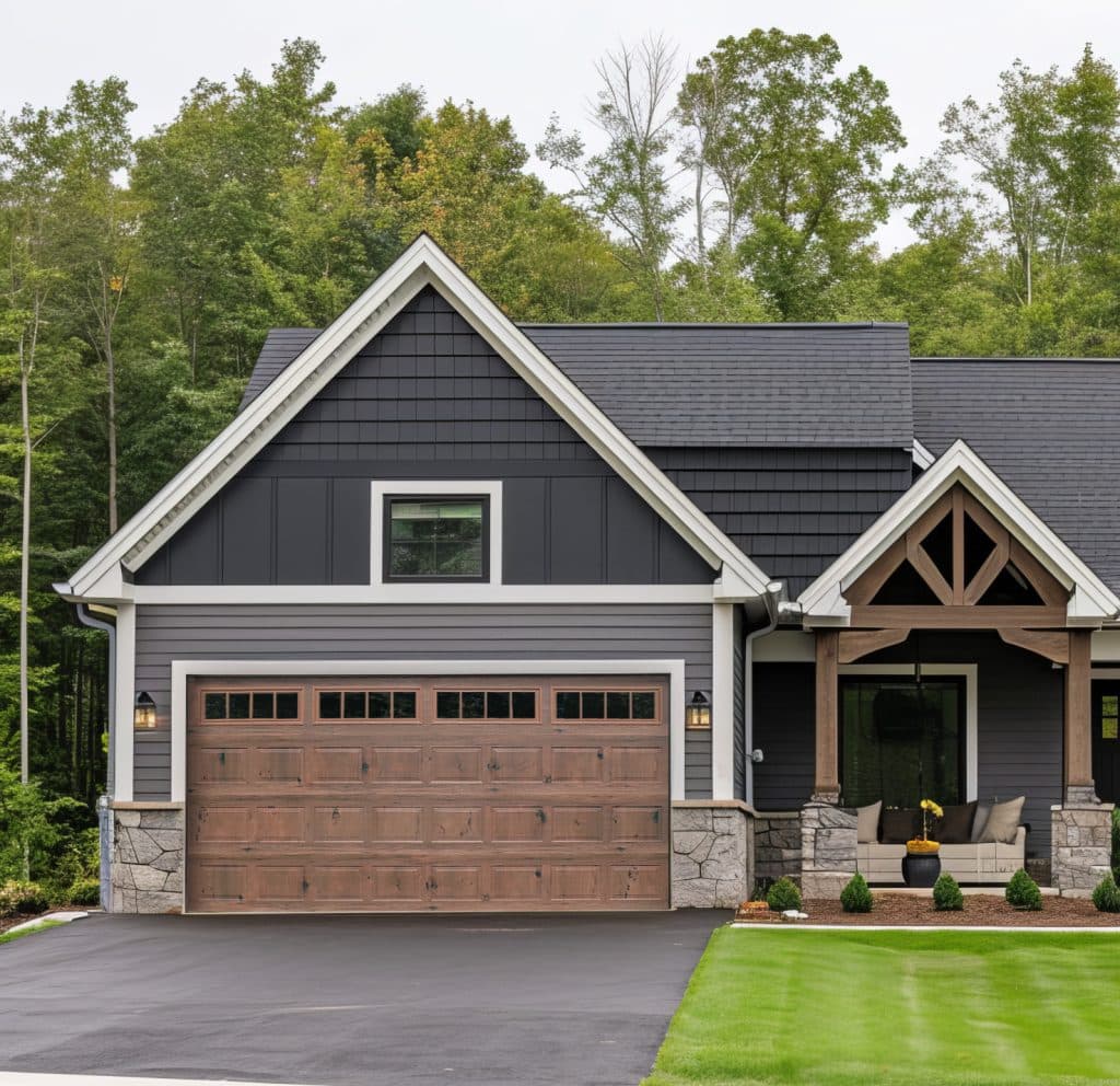 Bi-Directional wood grain garage door in Vintage on a stone and siding home